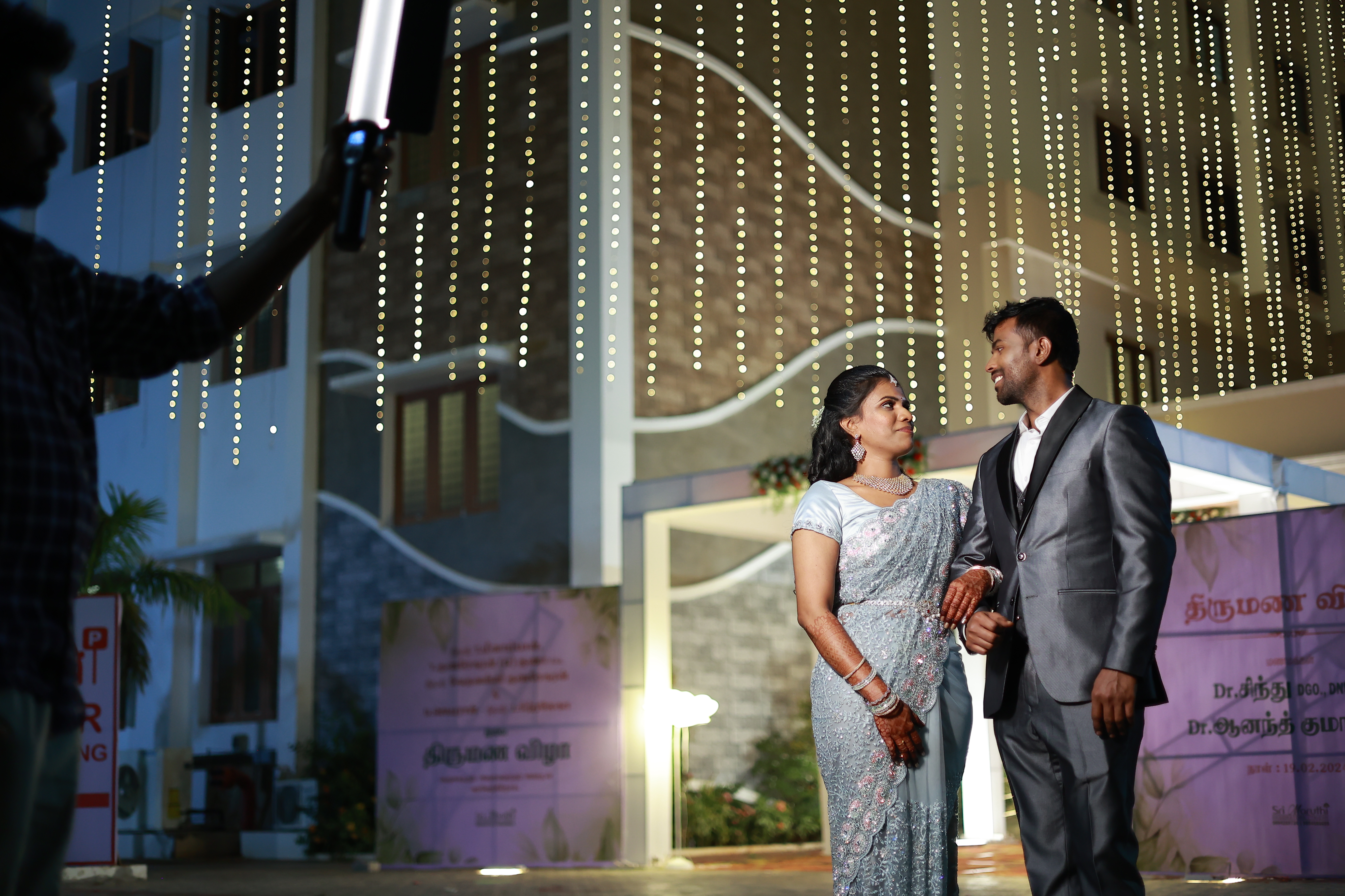 Couple with floral backdrop